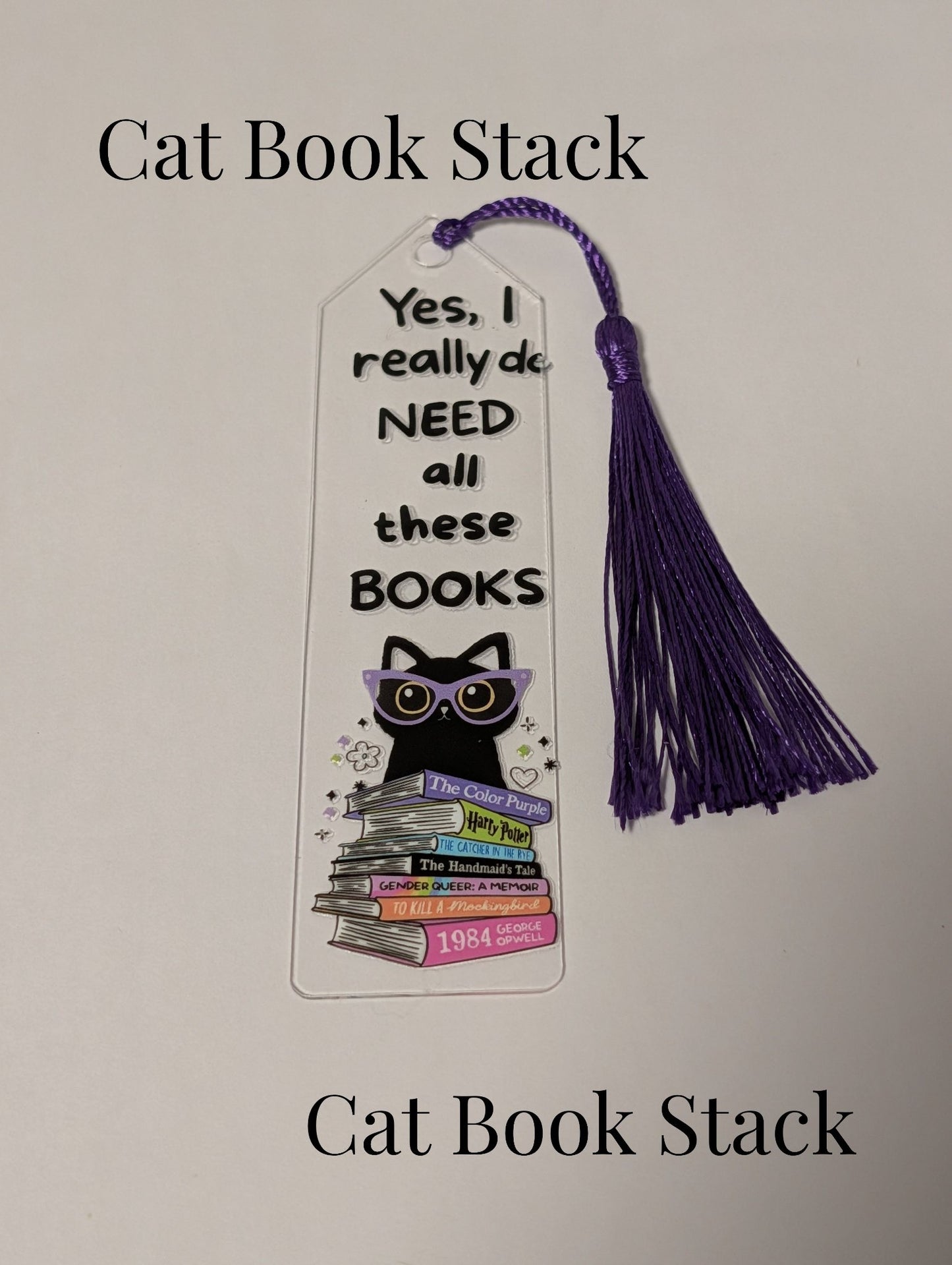 6a041d51b48fe50b080237df_10-cat-book-stack_1782074145346.jpg