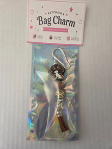 6a041d51b48fe50b080237df_brown-dog-paw-bag-charm_1783110620936.jpg