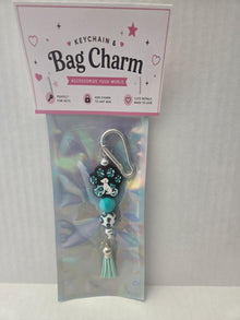 6a041d51b48fe50b080237df_teal-on-teal-dog-paw-charm_1783110162700.jpg