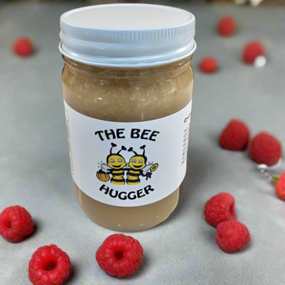 6a041d51b48fe50b080237df_the-bee-hugger-creamed-raspberry-honey-front_1784469323584.png